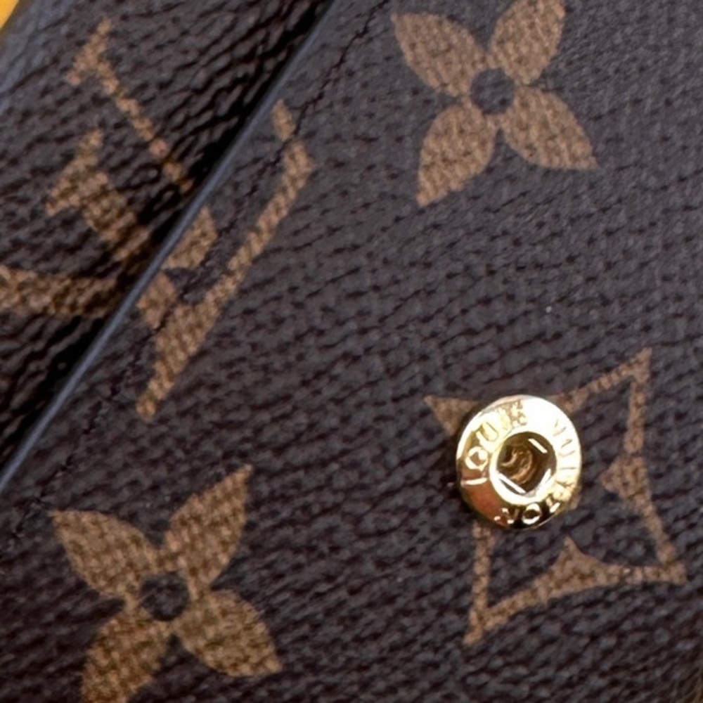 AUTHENTIC Louis Vuitton key holder. Monogram pattern. Magenta interior. - Picture 4 of 15